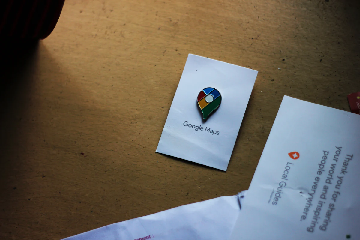 Google Maps pin card on a desk